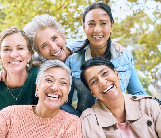 Photo of five women smiling