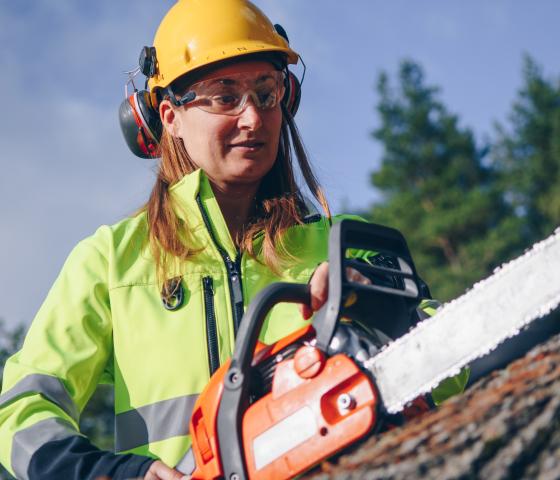 person using a chainsaw